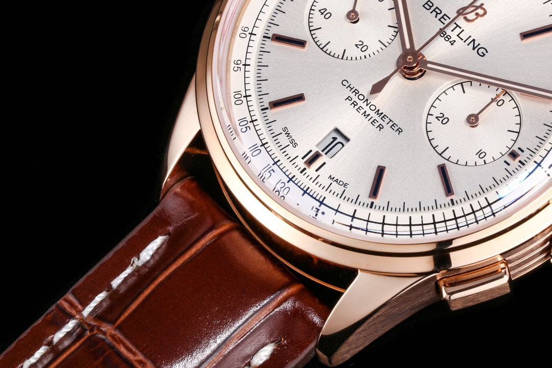 Rep Breitling automatic chronograph with rose gold tone case, brown leather strap and exhibition caseback